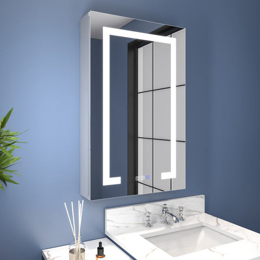 Bathroom with a illuminated mirror cabinet and sink against a blue wall.