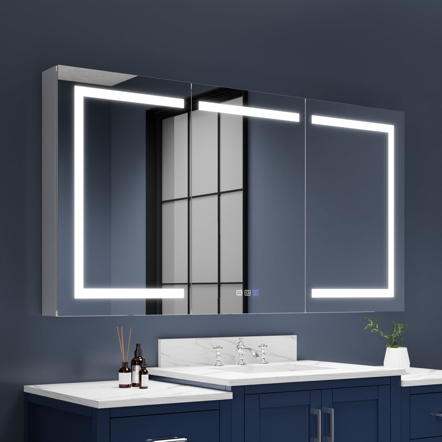 Bathroom vanity with illuminated mirror against a dark blue wall