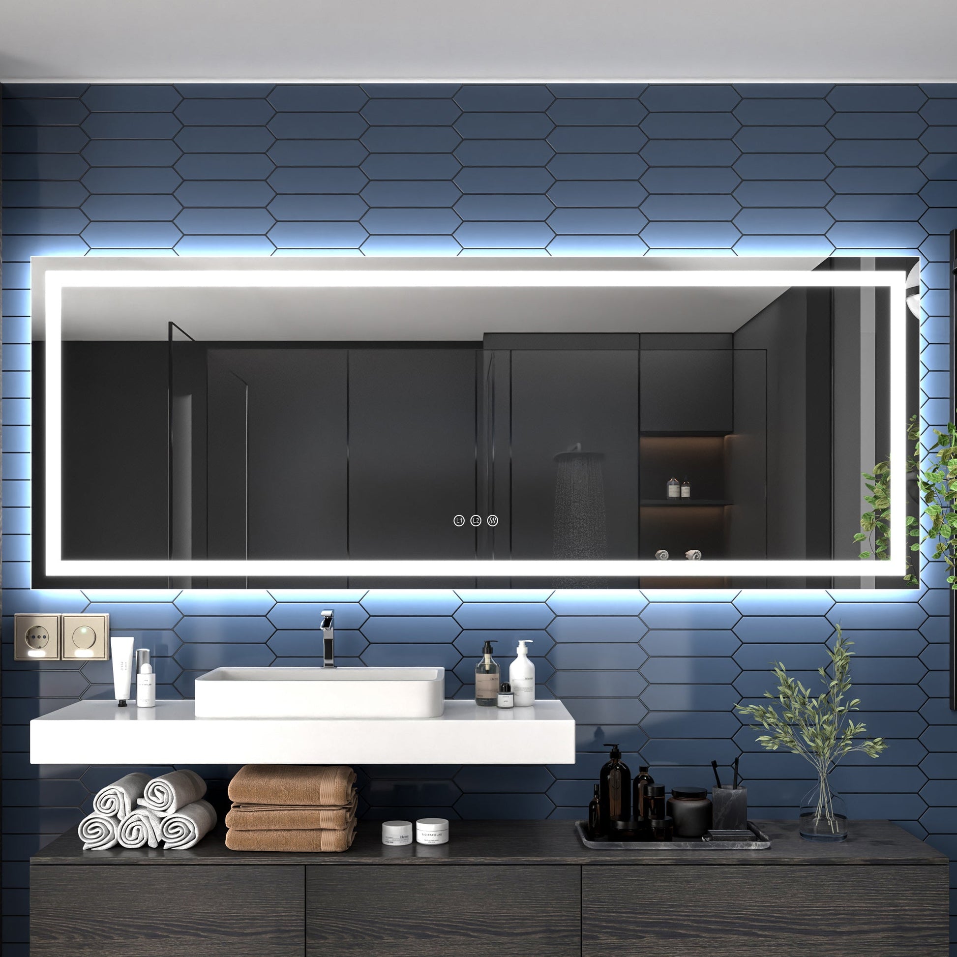 Bathroom with large illuminated mirror