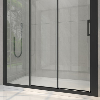 Modern shower enclosure with glass door and black frame in a tiled bathroom.