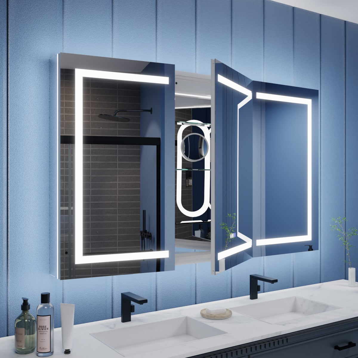 Bathroom vanity with a large illuminated mirror and blue wall.