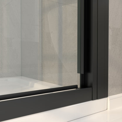 Close-up of a black-framed glass shower enclosure with a neutral background.