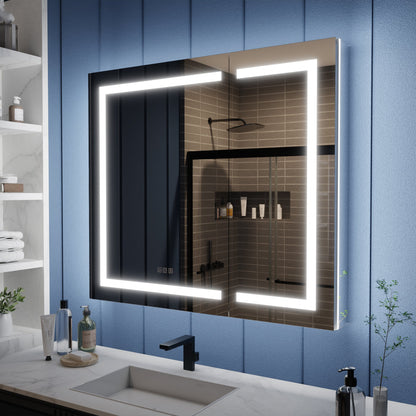 Bathroom with a large illuminated mirror above a sink, against a blue paneled wall.