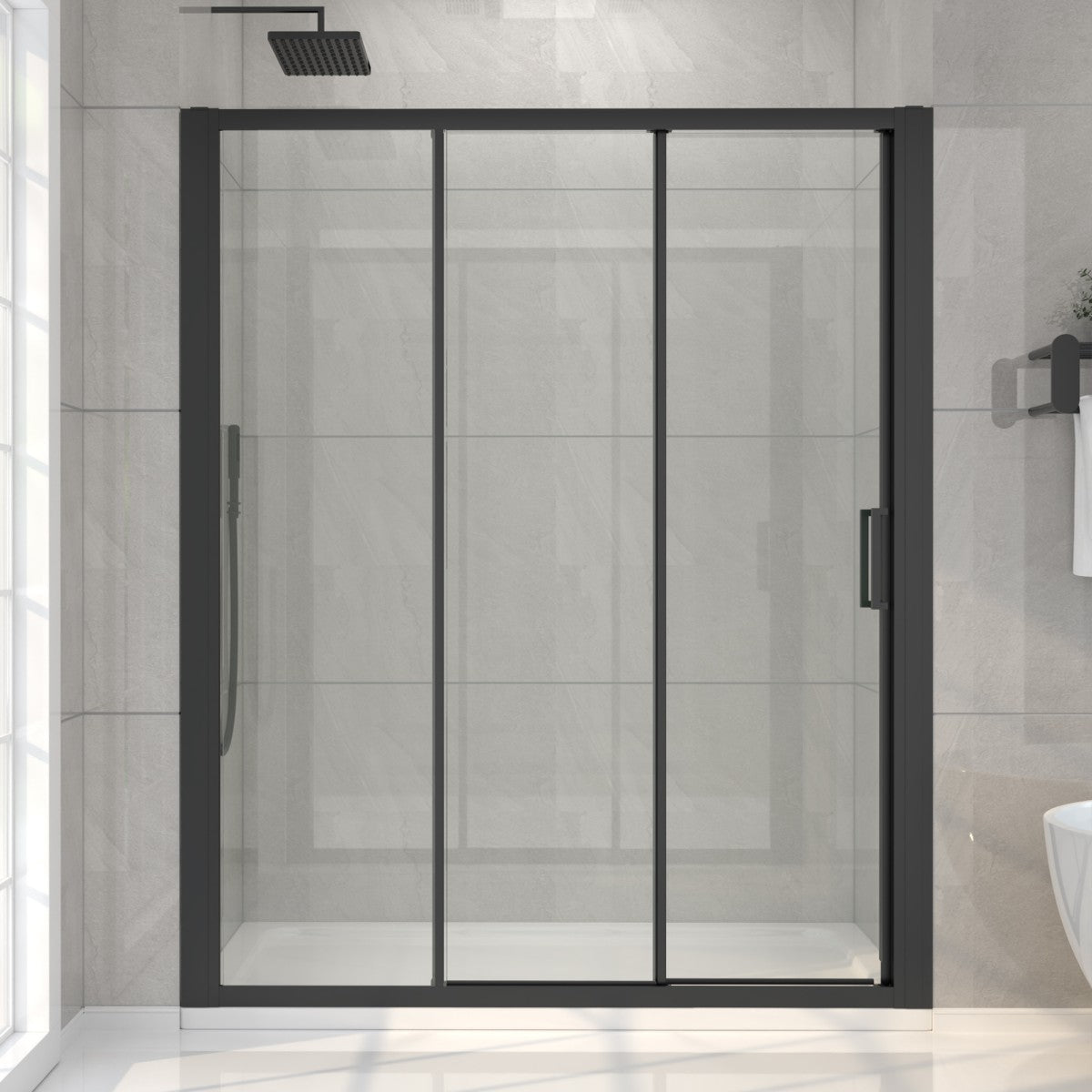 Modern shower enclosure with black frame and glass door in a bathroom setting.