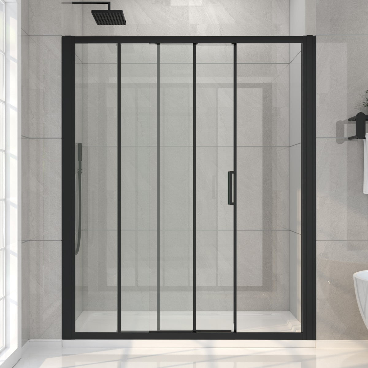Black-framed shower enclosure in a bathroom with tiled walls.