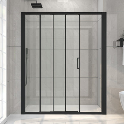 Black-framed shower enclosure in a bathroom with tiled walls.