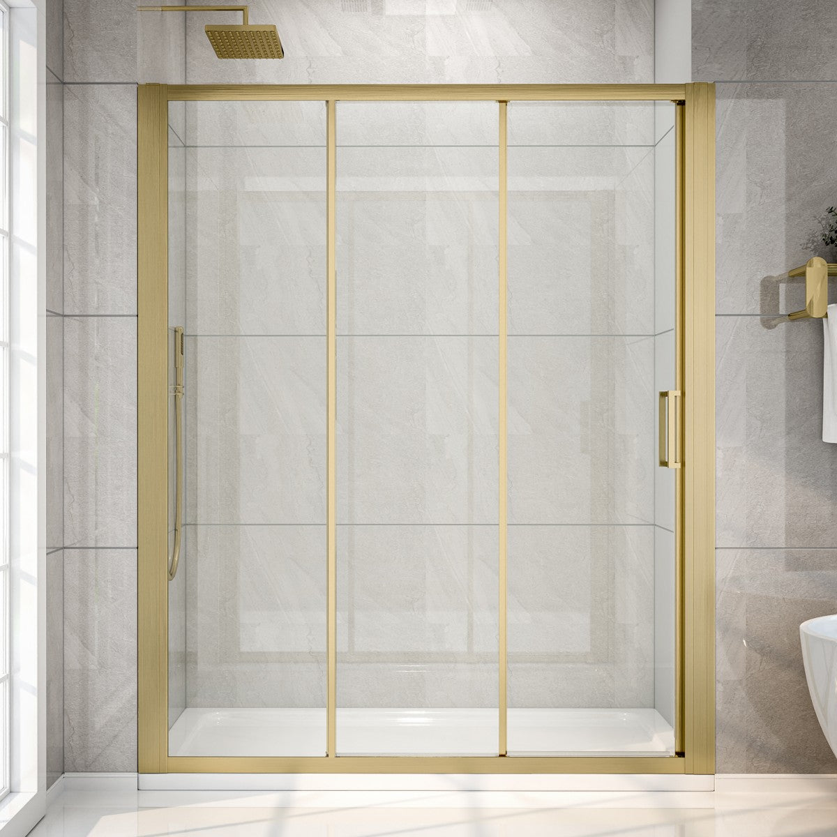 Shower enclosure with gold frame and glass doors in a tiled bathroom.